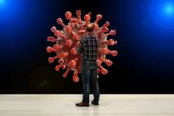 Illustration Thema Corona - Mann steht vor riesigem Virus-Modell