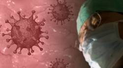 Corona-Virus, symbolisch dargestellt und Mann mit medizinischer Maske