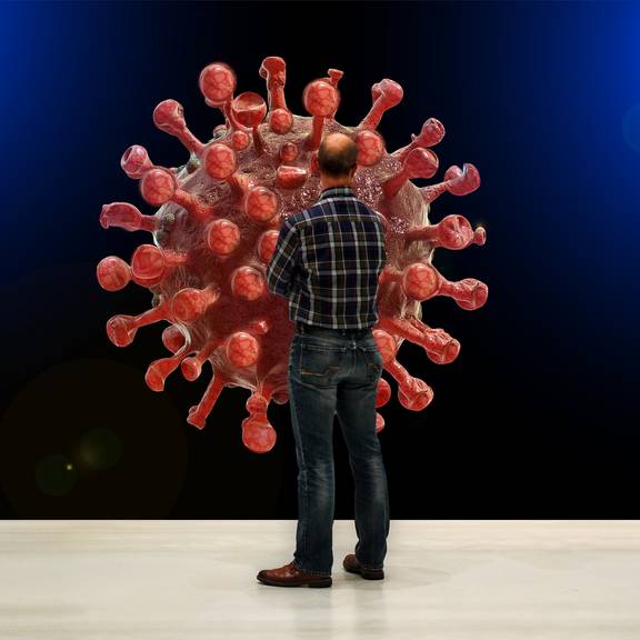 Illustration Thema Corona - Mann steht vor riesigem Virus-Modell